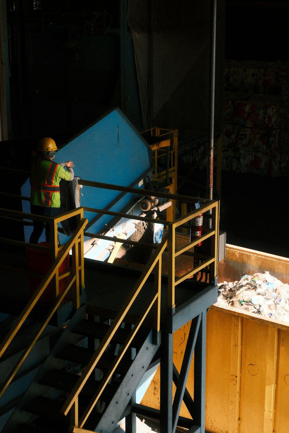 Worker operating a material recovery line